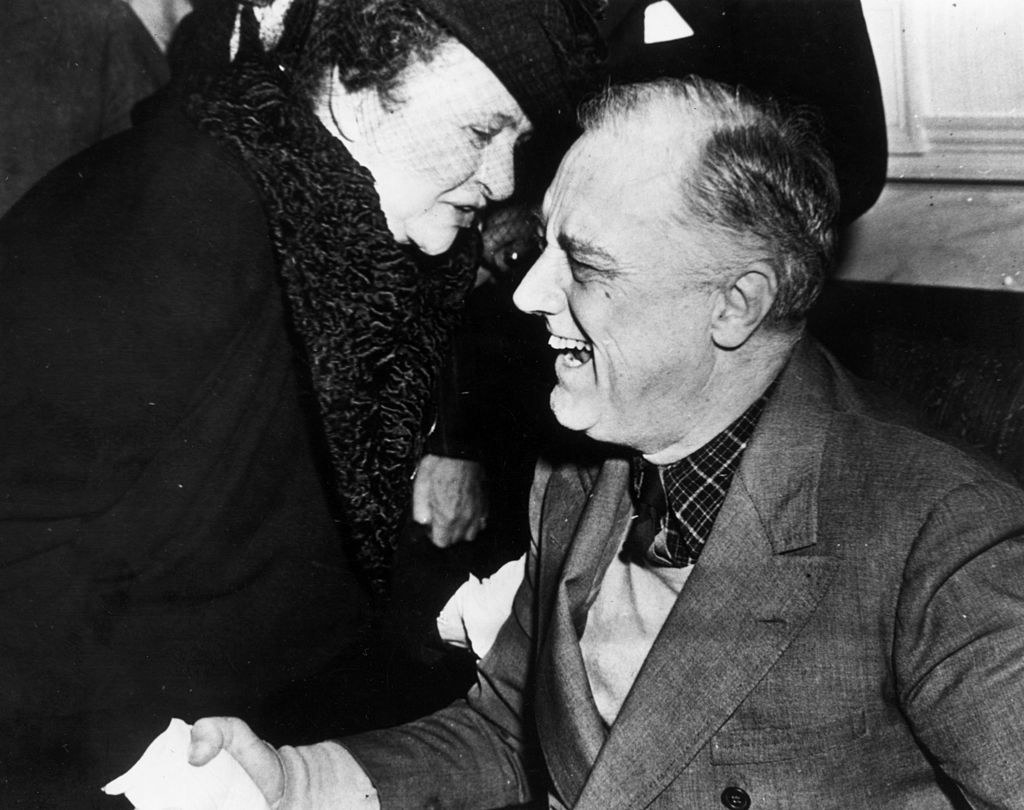 Perkins shaking hands with FDR