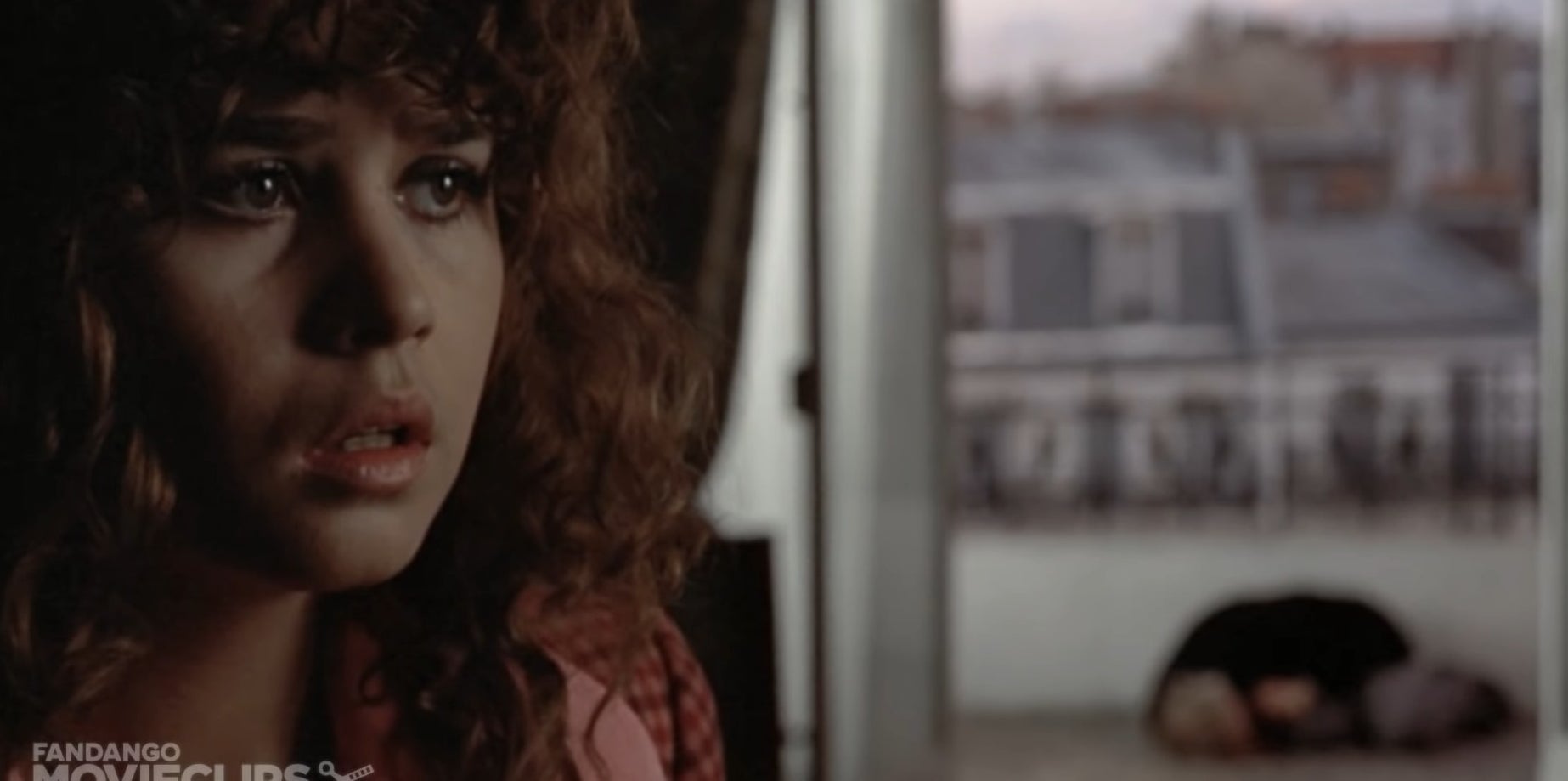 Close-up of Jeanne with Paul&#x27;s dead body in the background in &quot;Last Tango in Paris&quot;