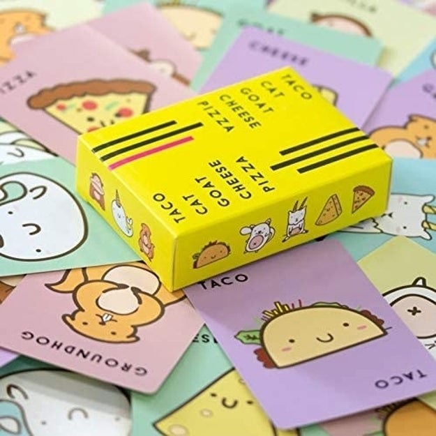 A bunch of the different cards face up, each one is a different pastel color with an illustrated character on it and their name (i.e. &quot;Taco&quot;)