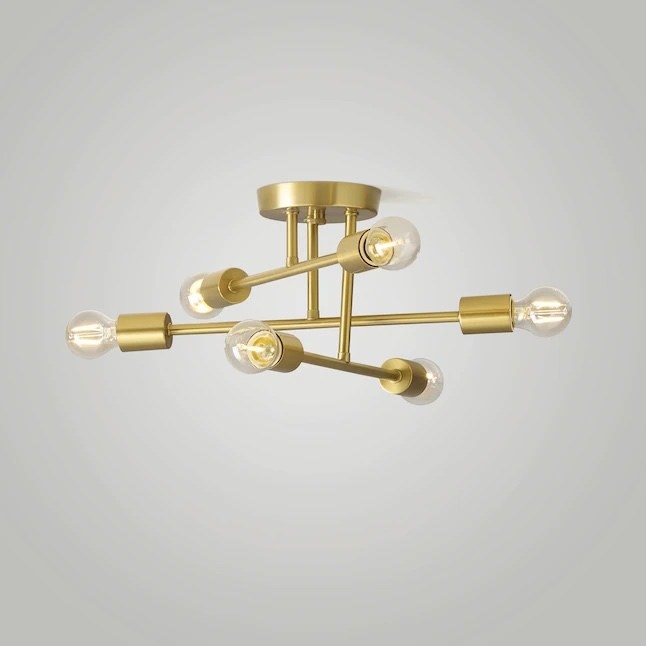 a brushed gold mount light attached to the ceiling
