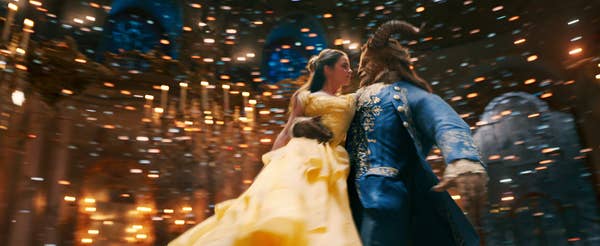 Belle and the beast dancing in a ballroom