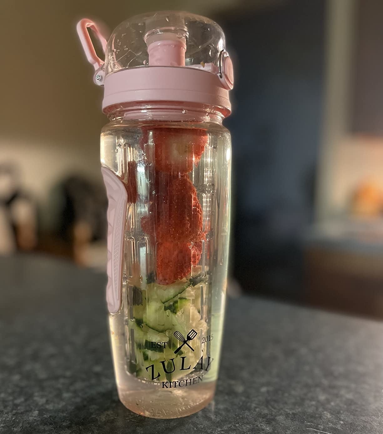 a reviewer photo of the bottle filled with fruits