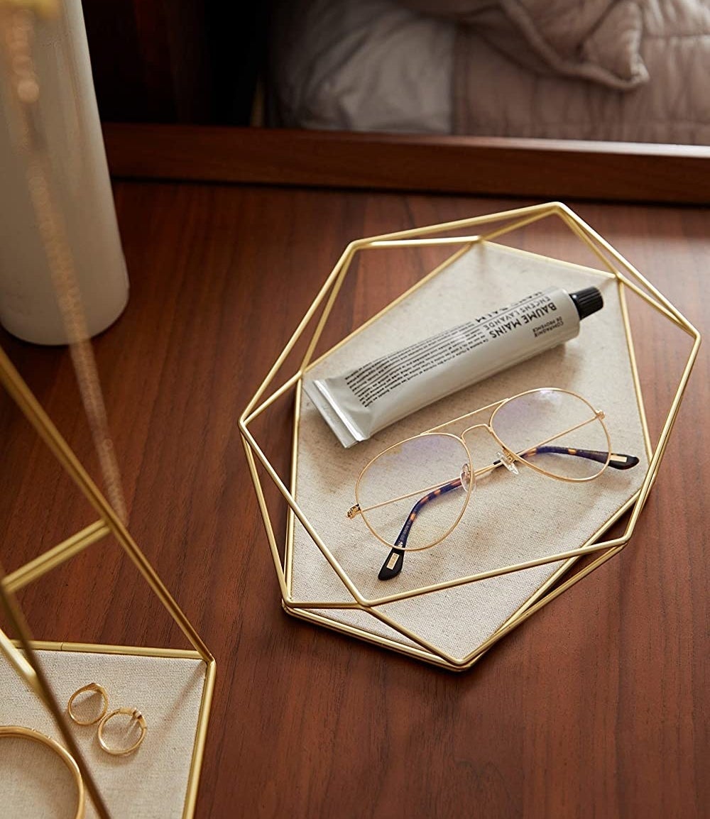 metallic trinkets tray on a desk