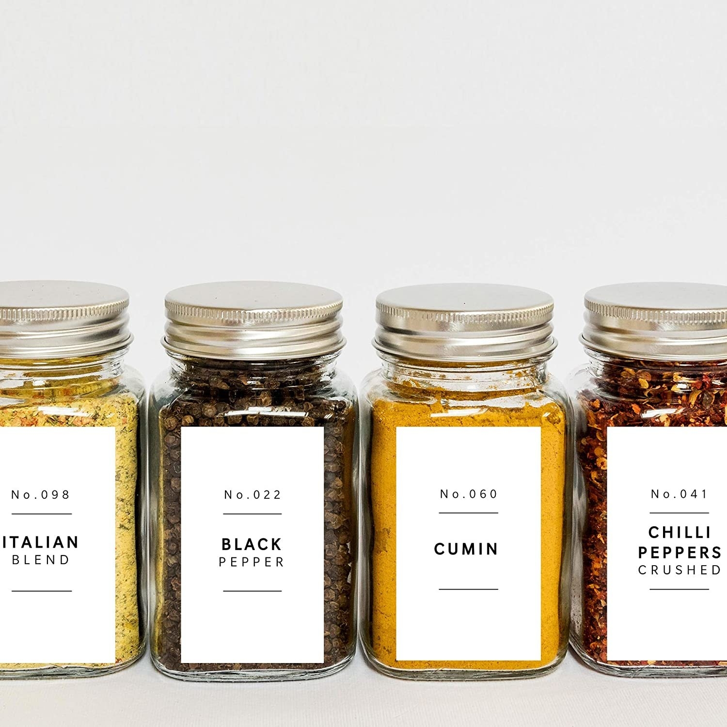spice jars with labels on each one