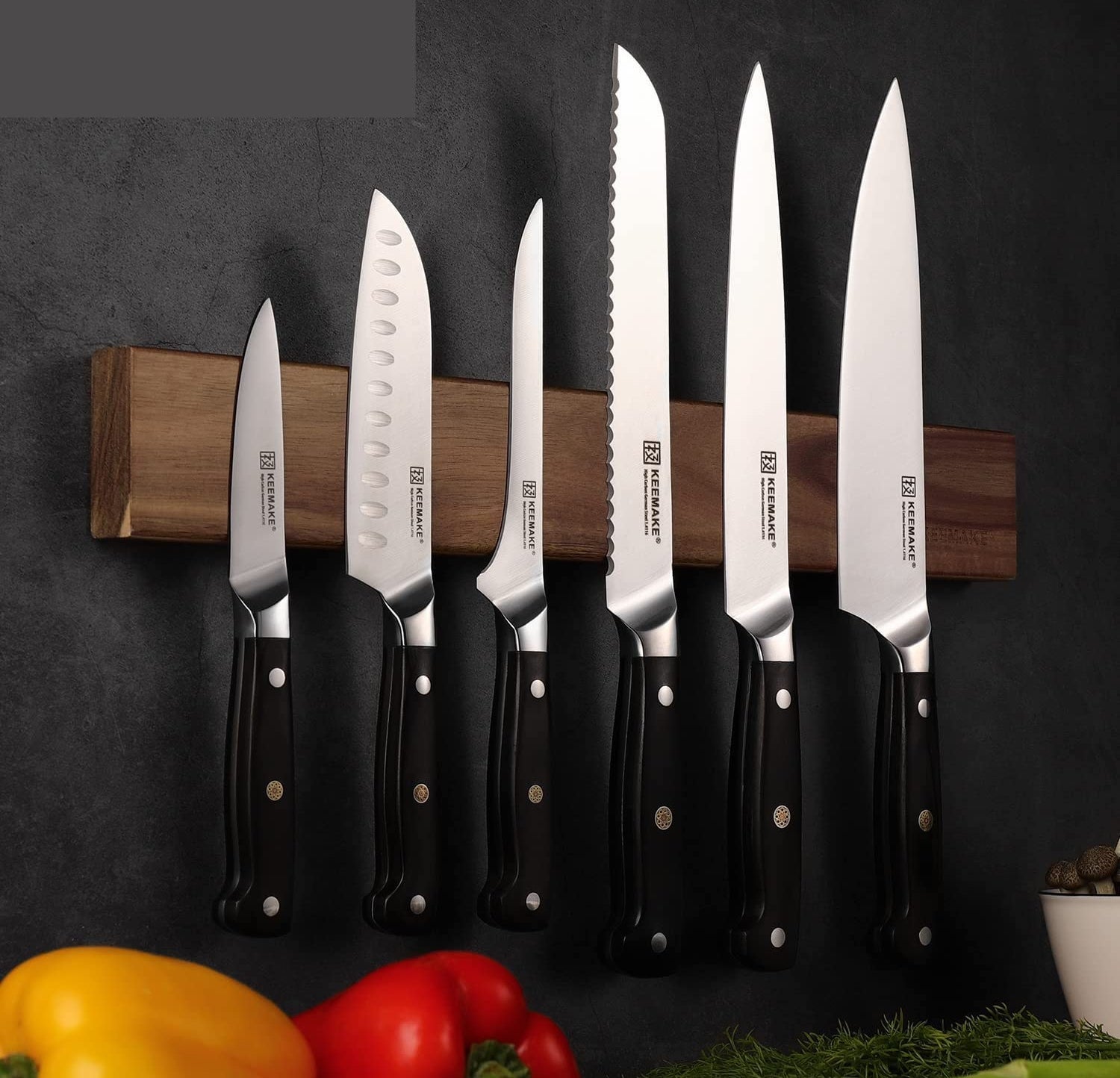 a knife set mounted on a magnetic wall strip