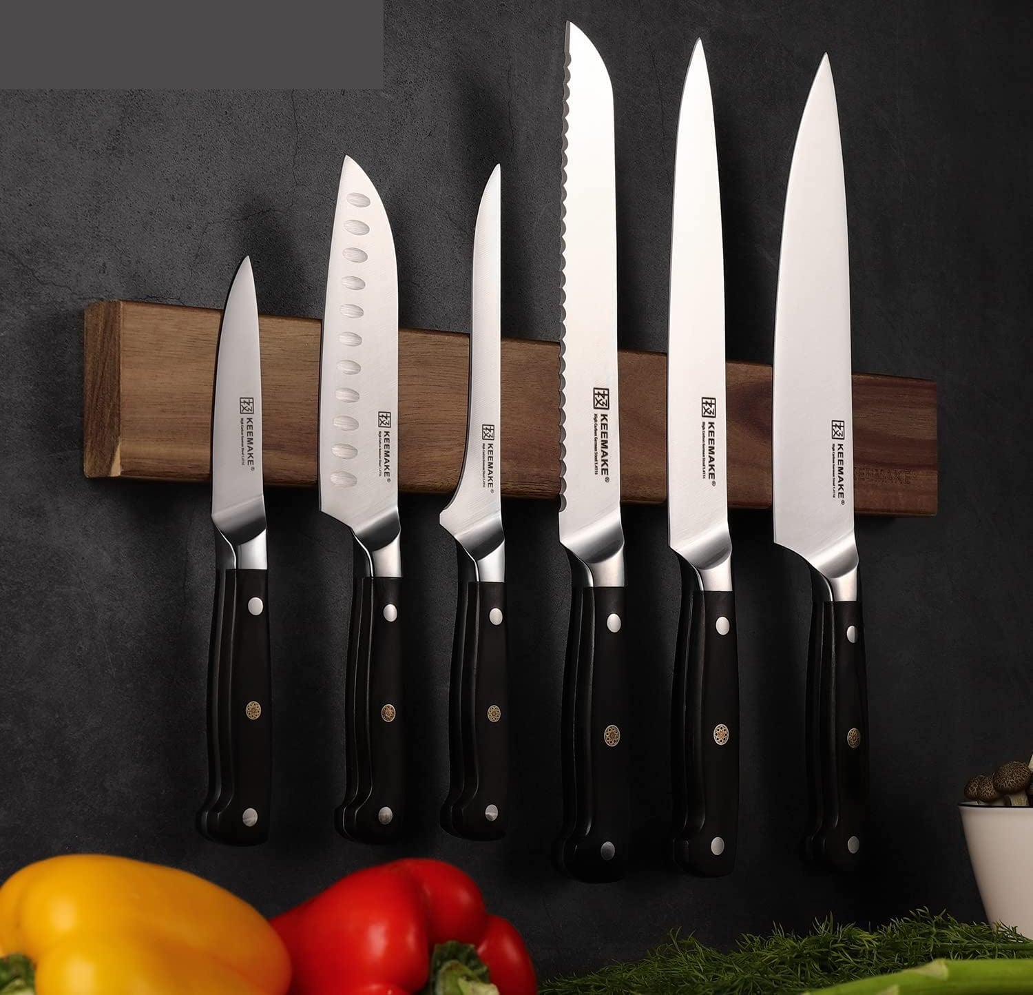 a knife set mounted on a magnetic wall strip