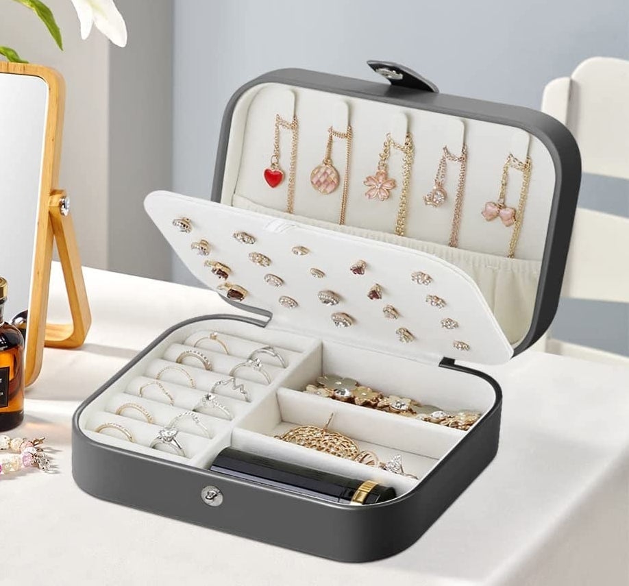 a jewellery box with jewellery in each compartment