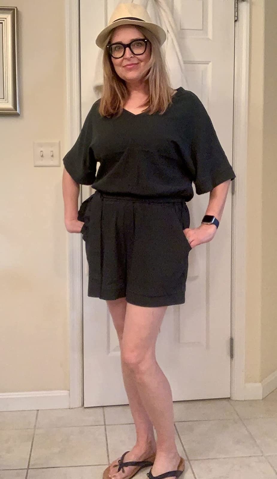 Reviewer in the black short sleeve romper