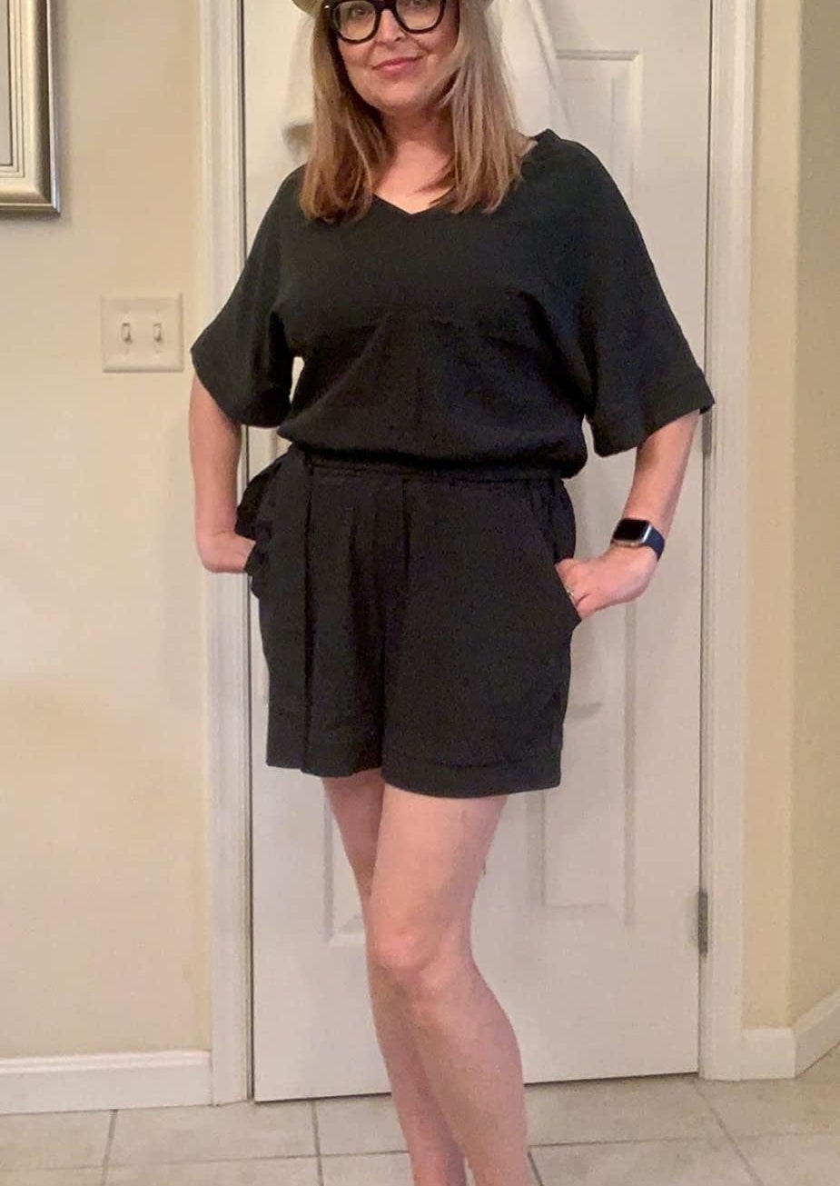 Reviewer in the black short sleeve romper