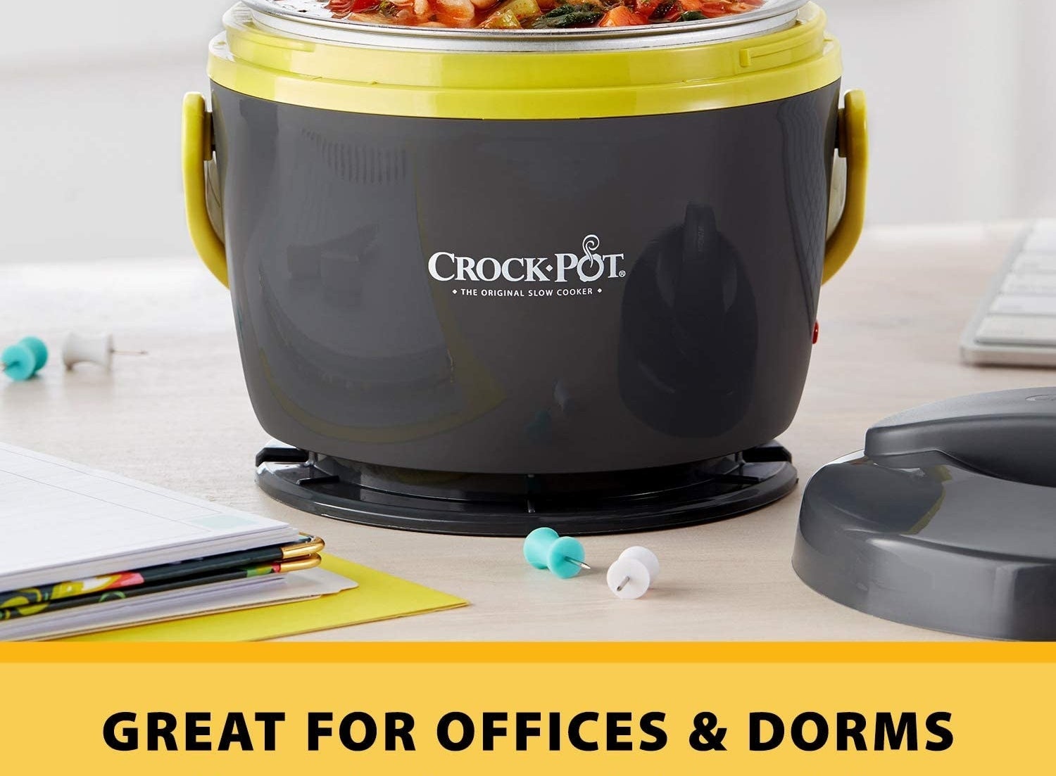 the crock-pot on a desk next to office supplies