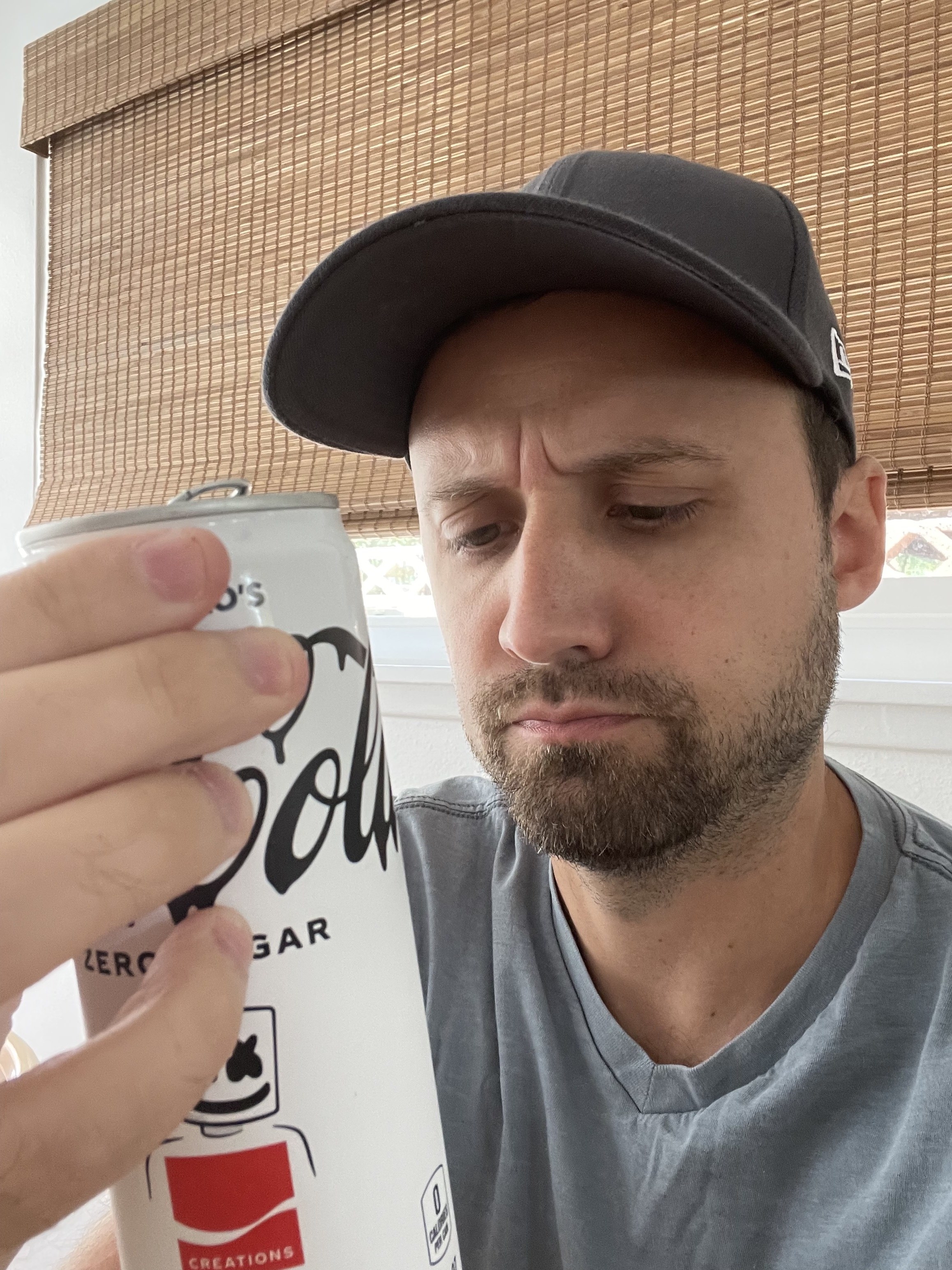 The author looking at the writing on the can