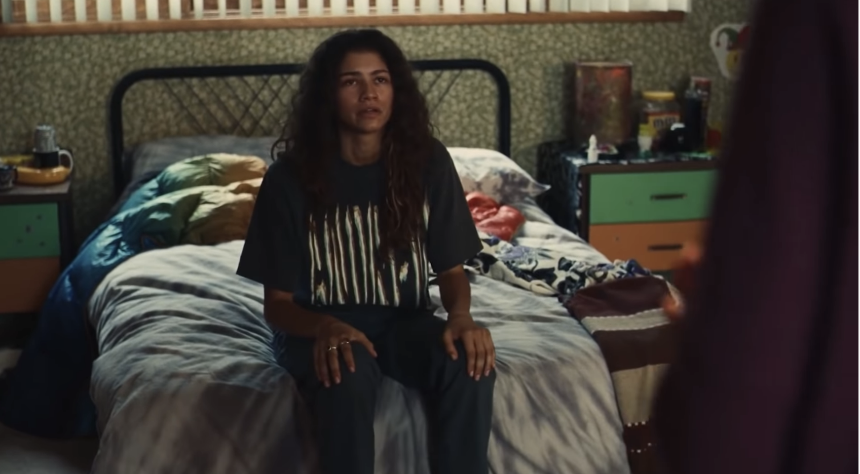 Zendaya sitting on the edge of a bed in &quot;Euphoria&quot;