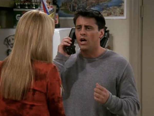 joey on the phone looking in shock