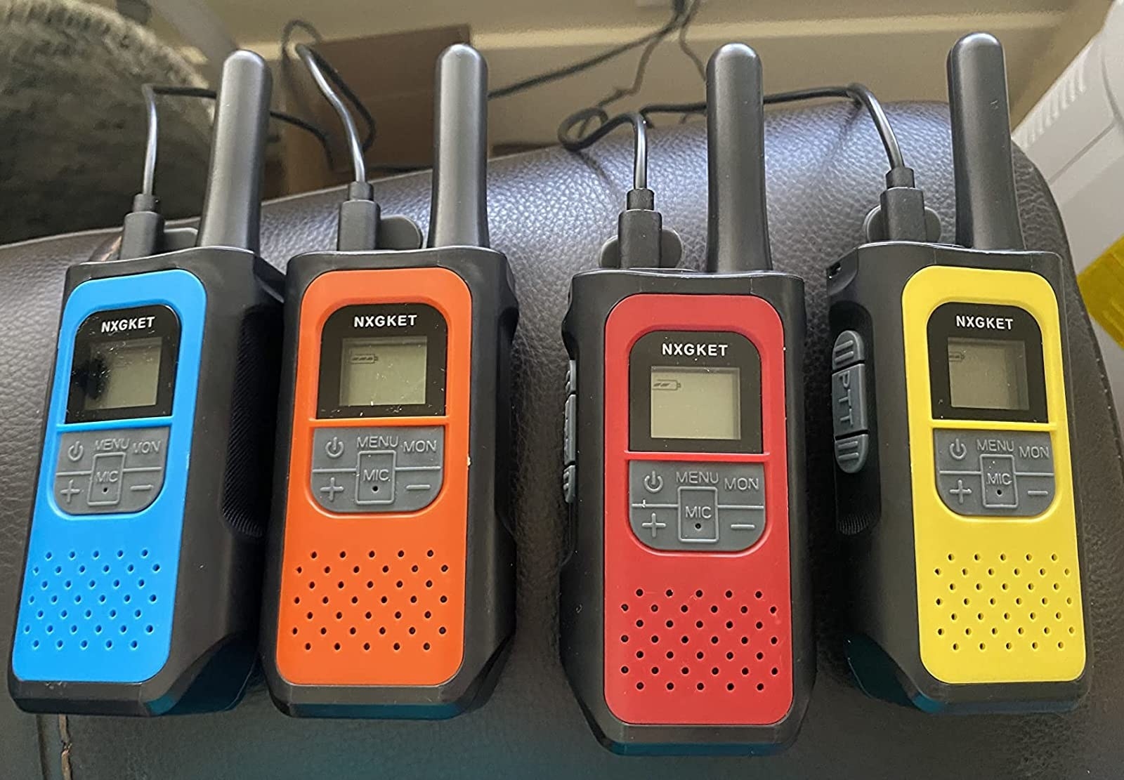 the four radios; one blue, one orange, one red, and one yellow