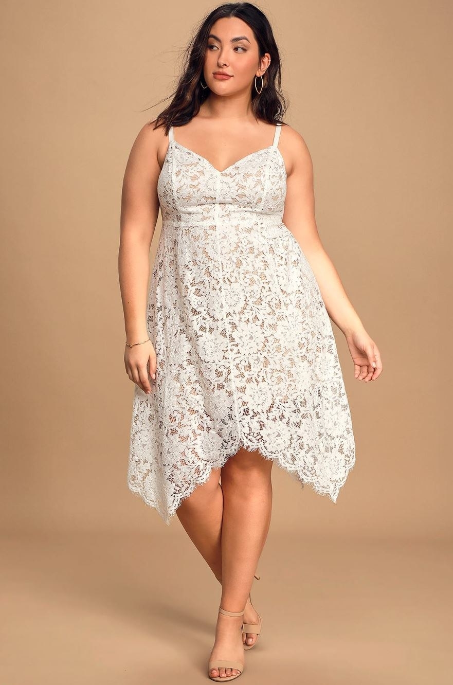 model wearing white lace dress
