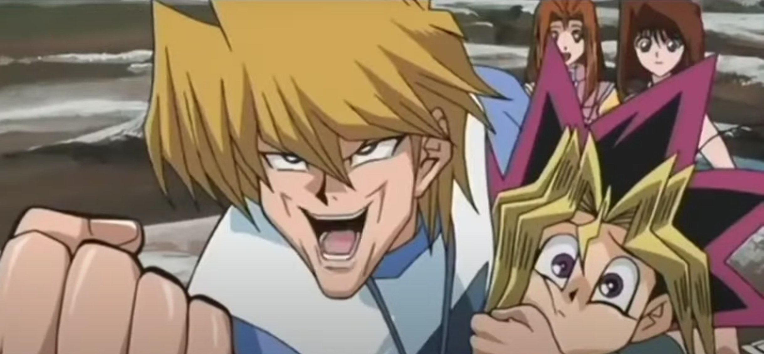 Joey making a funny face while holding Yugi