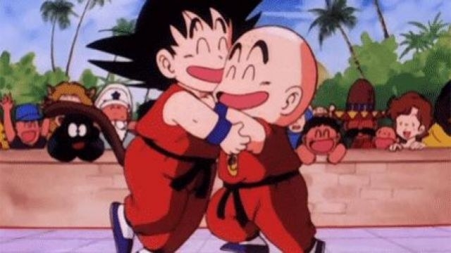 Young Goku and Krillin hugging