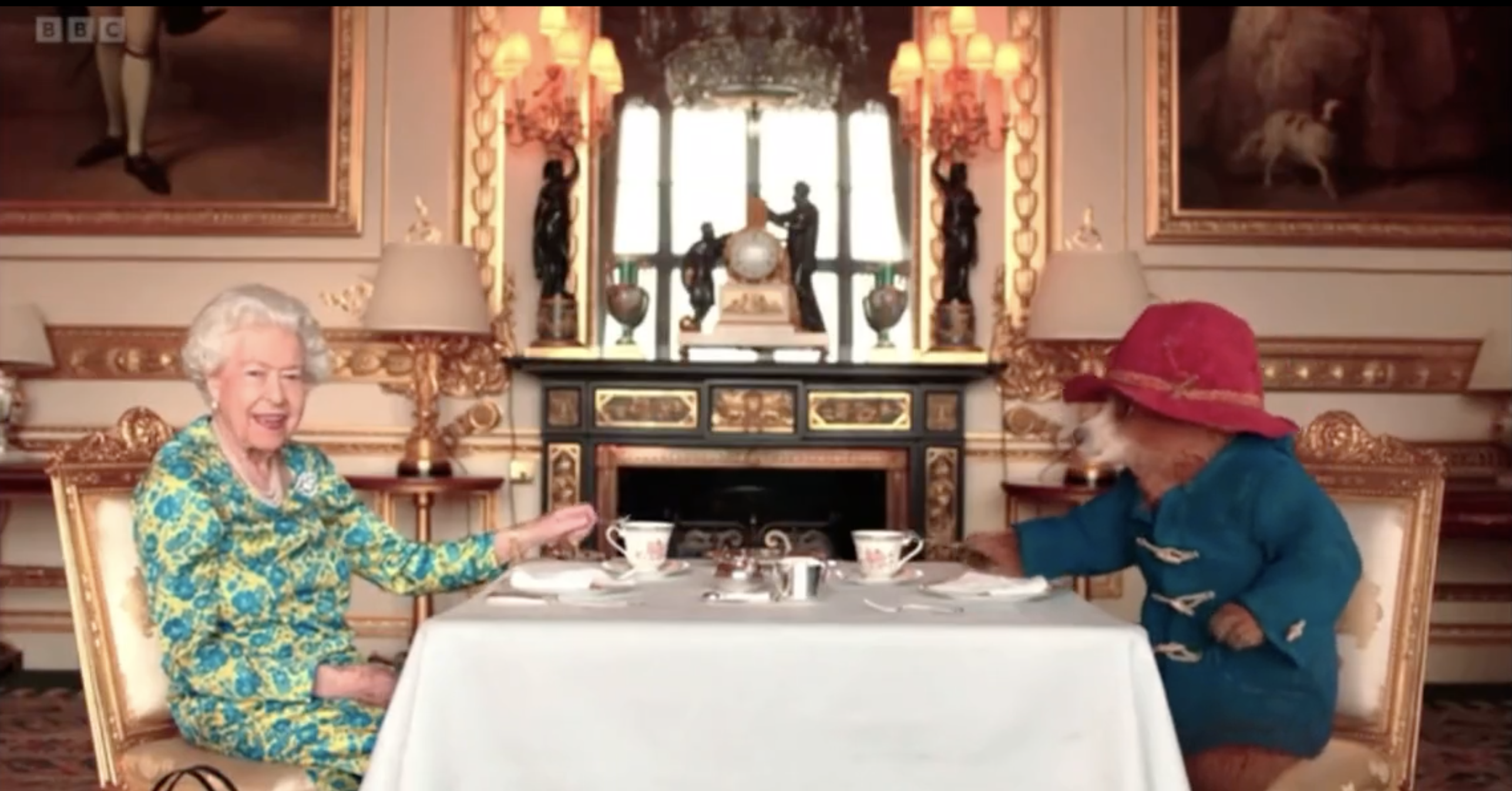 The Queen and Paddington at the table