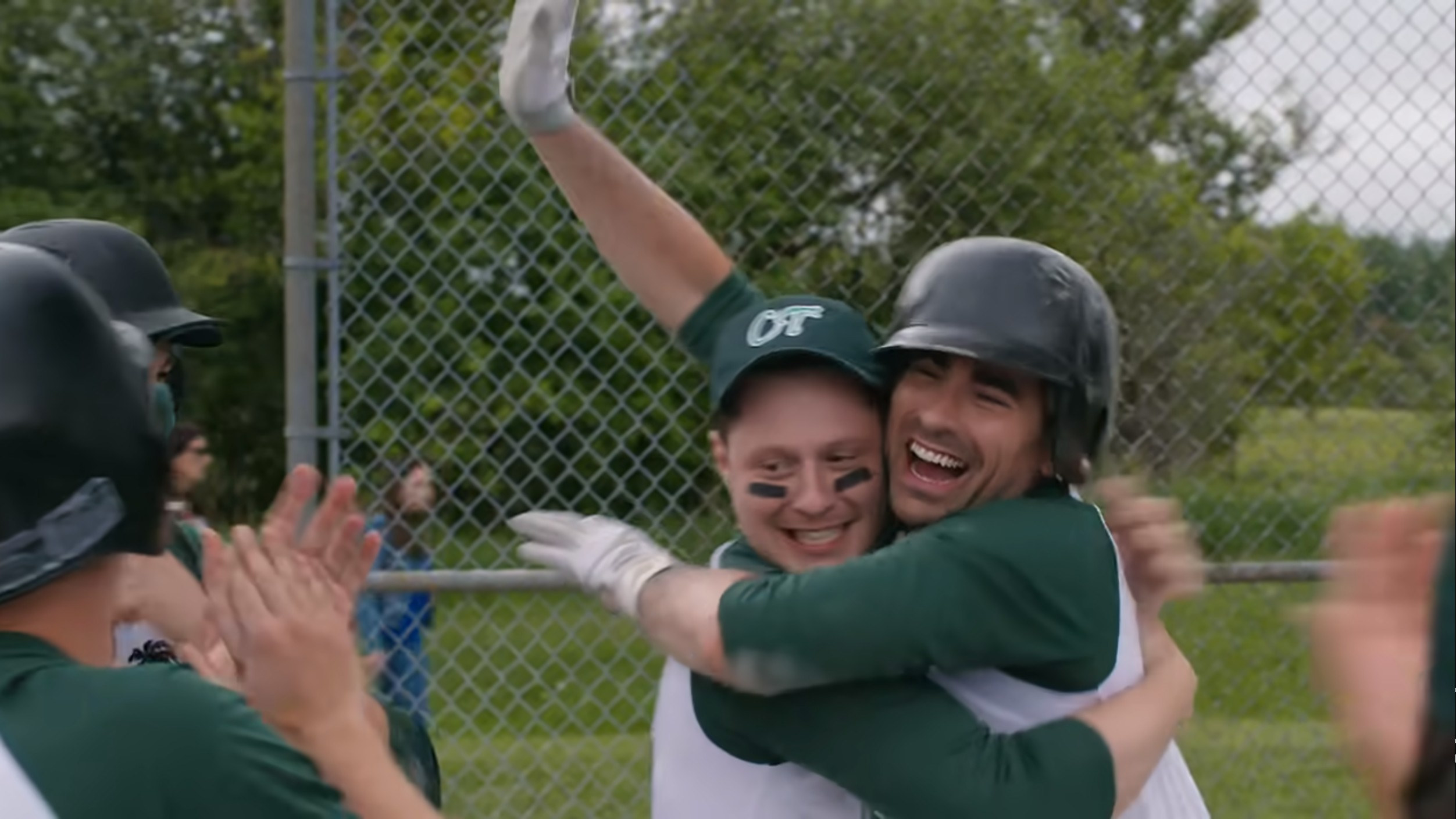 Patrick and David hugging on the baseball field