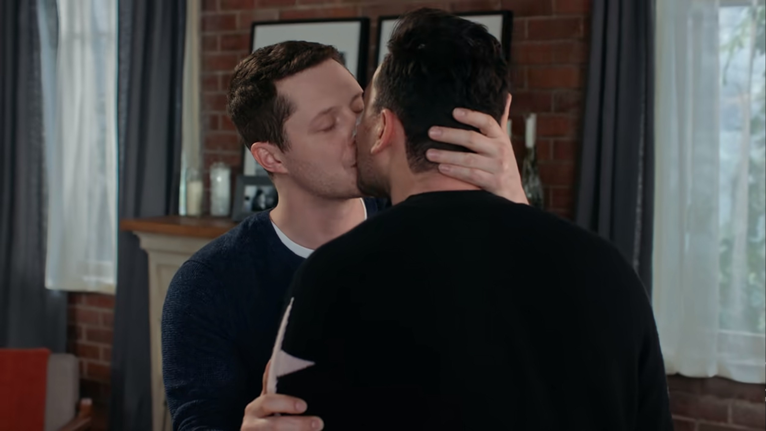 Patrick and David kissing