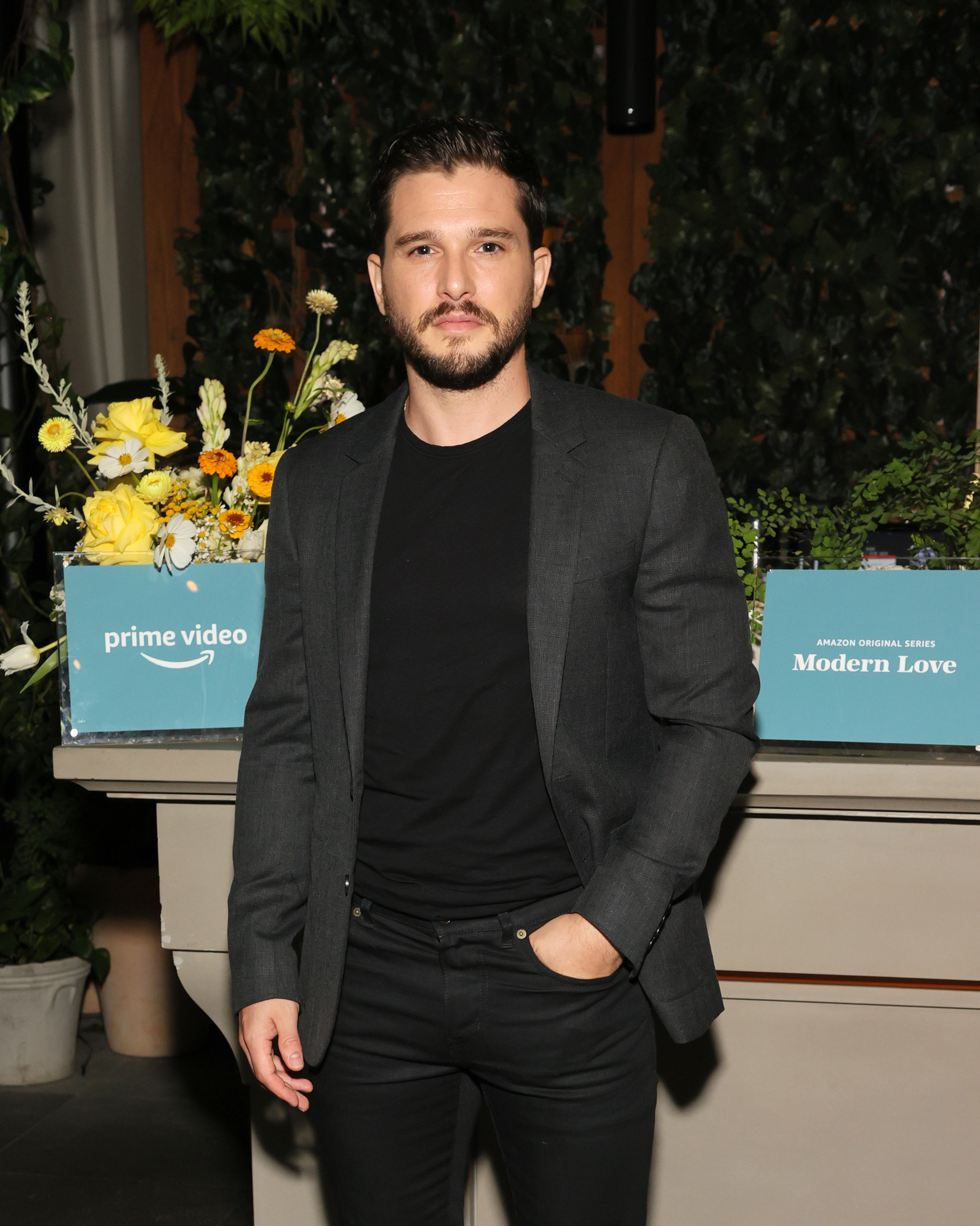 Kit posing with his hand in his pocket