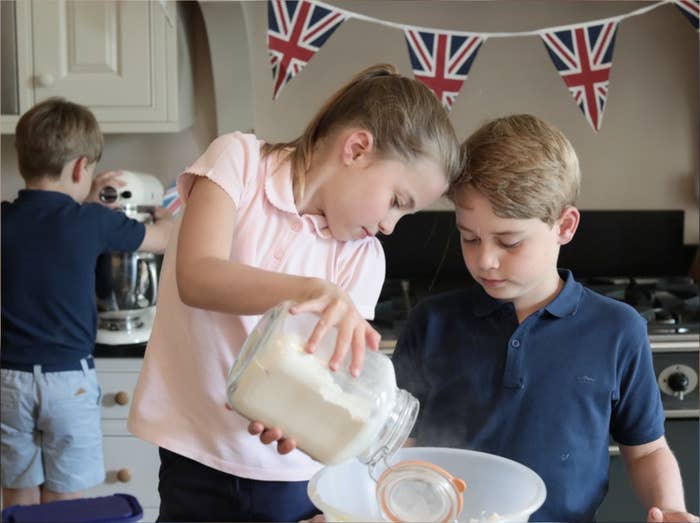 Princess Charlotte and Prince George pouring ingredients into a bowl