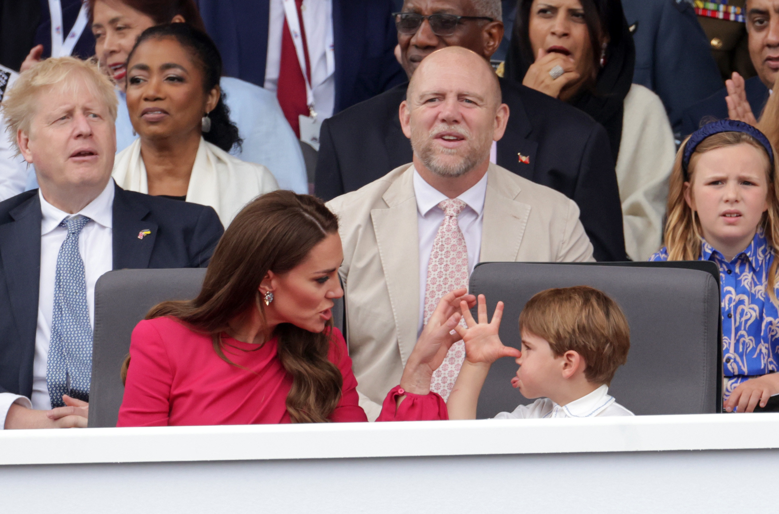 The duchess appears to scold Prince Louis, who&#x27;s thumbing his nose at her