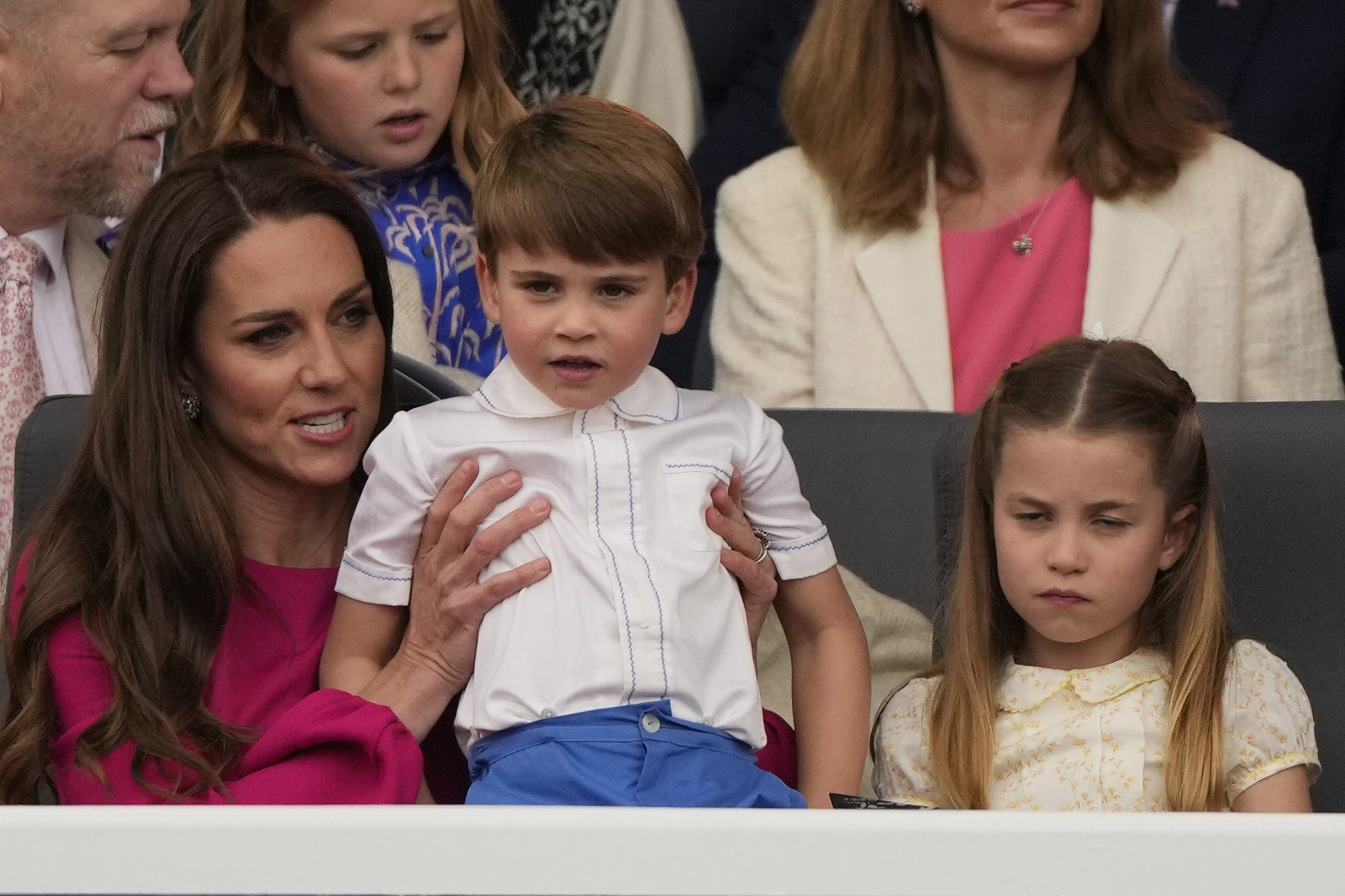 The Duchess of Cambridge holds Prince Louis