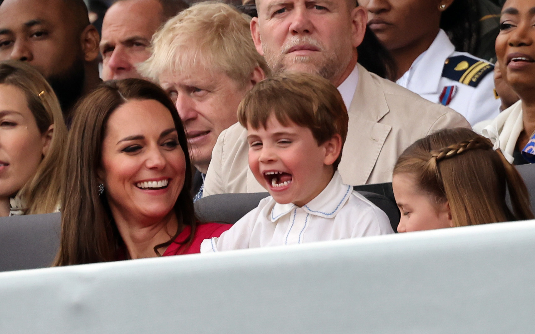 The duchess smiling at a smiling Prince Louis