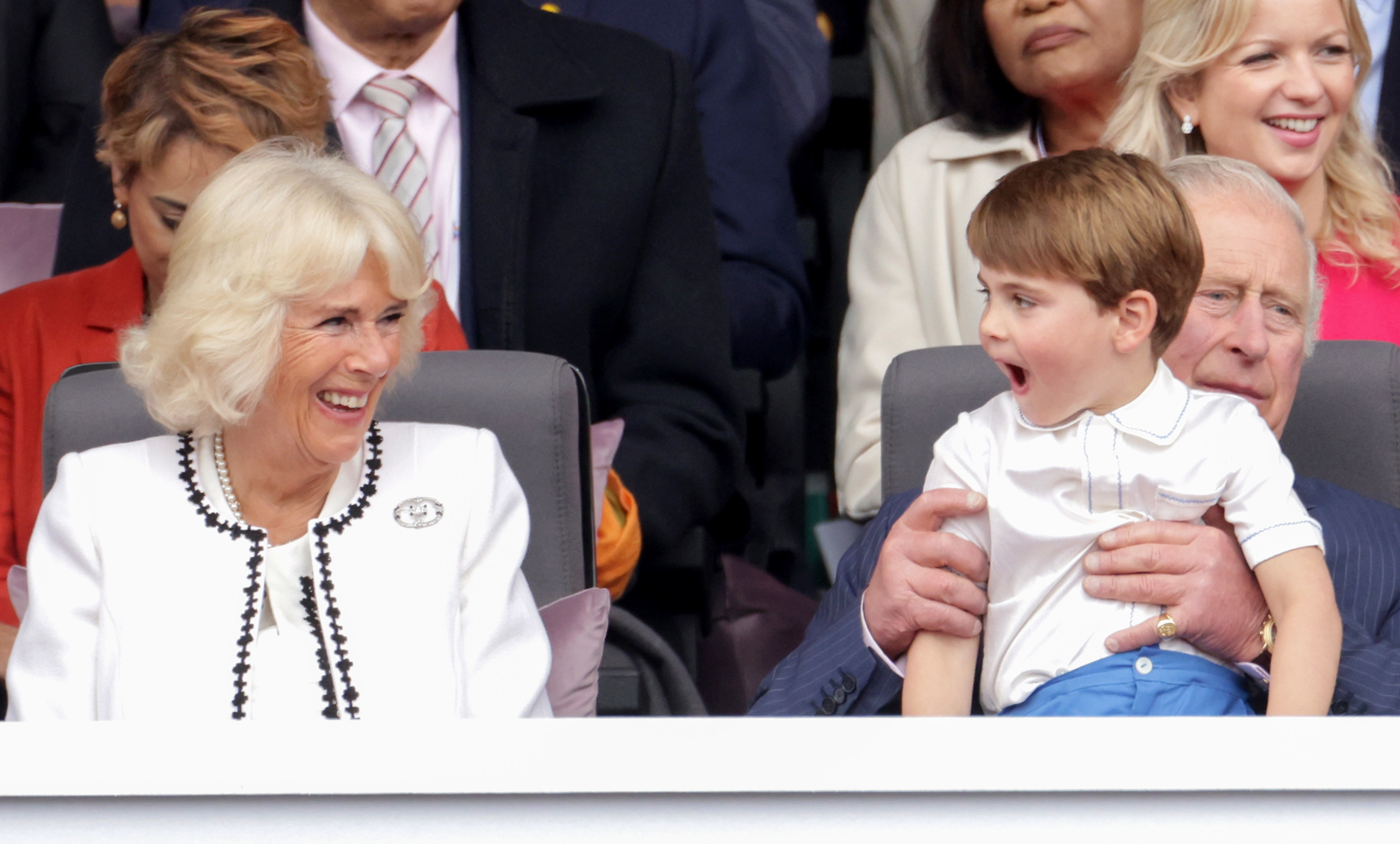 Camilla smiles at Prince Louis, who is sitting on Prince Charles&#x27; lap