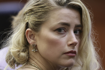 Amber Heard waits before the jury
