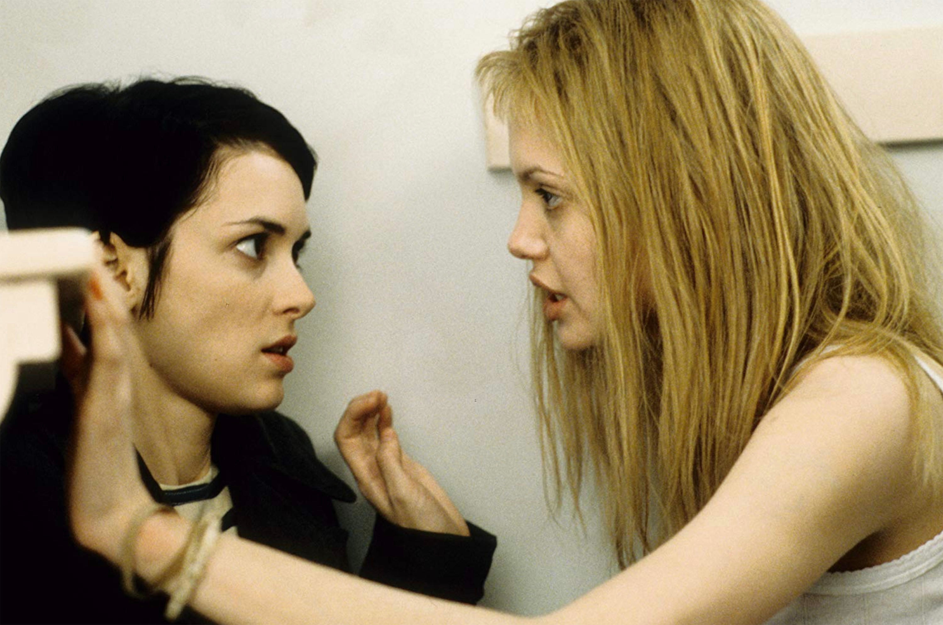 winona rider and angelina jolie staring at one another in girl, interrupted