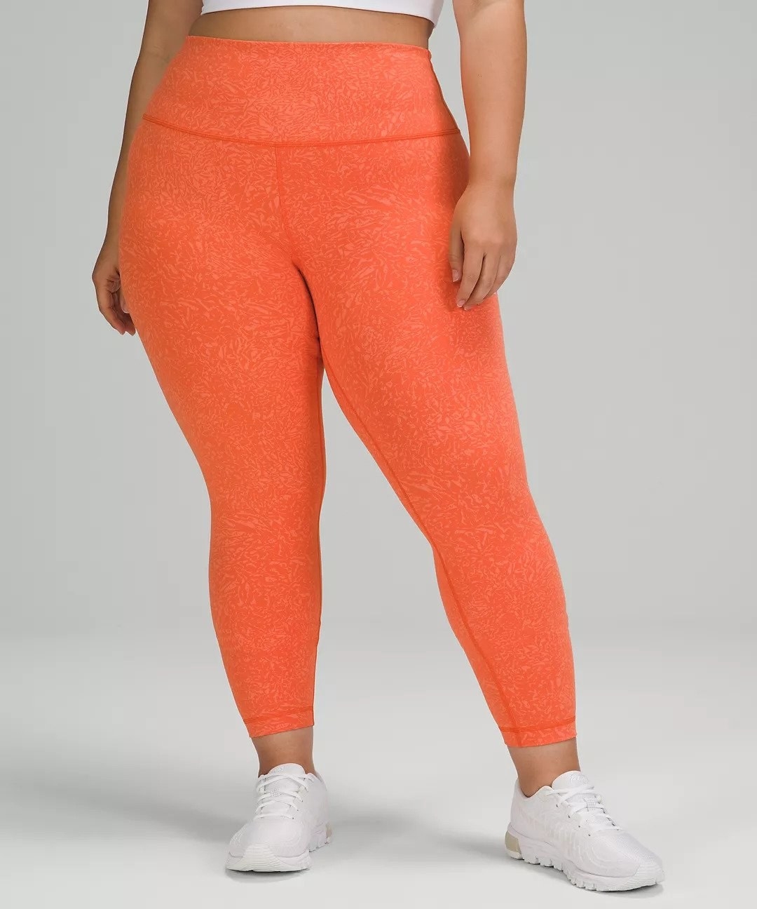 Model wearing the orange leggings