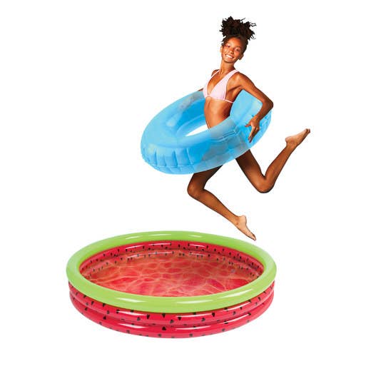 A young woman jumps over a watermelon-designed, three-ring pool