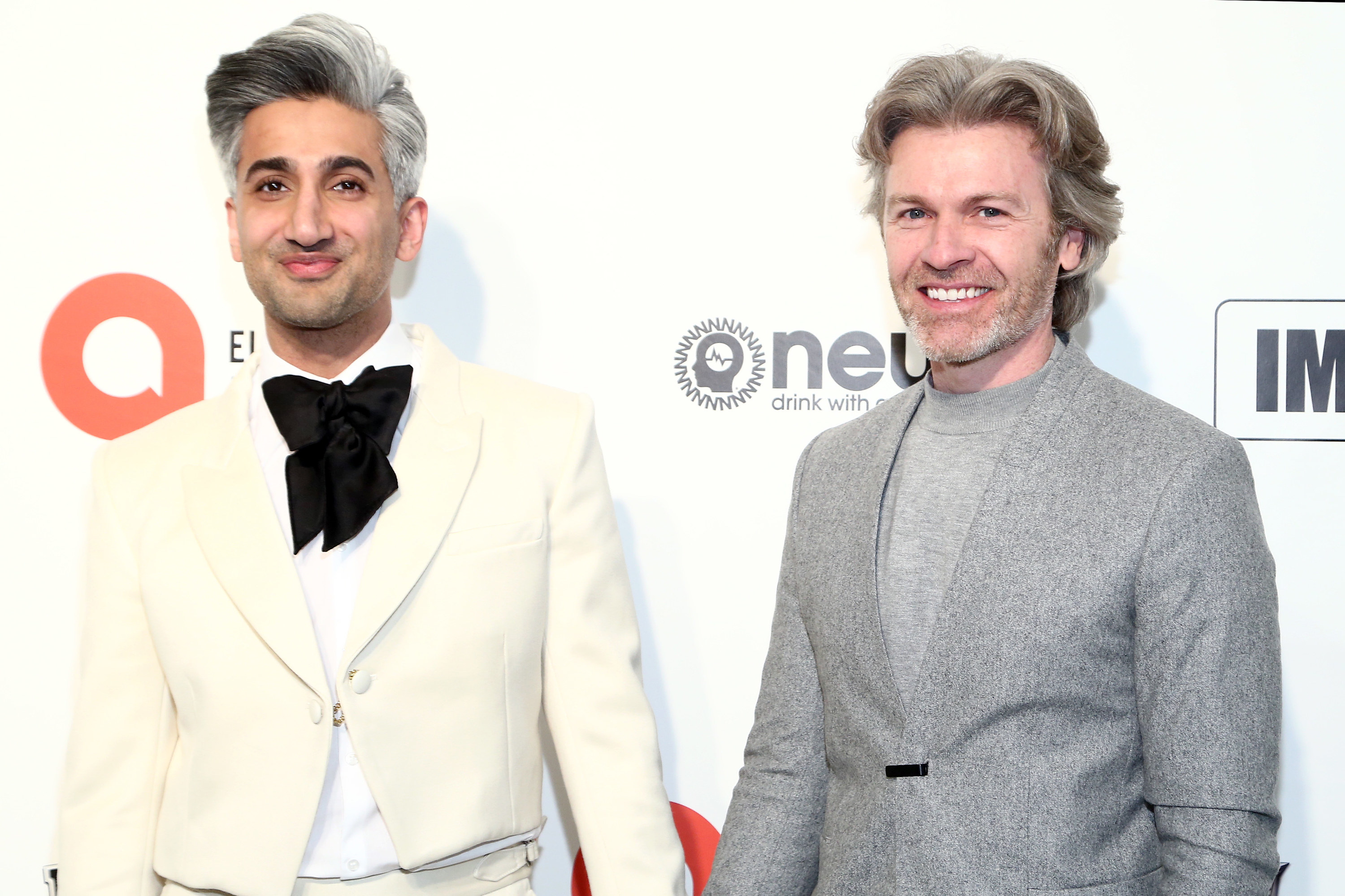 Tan France and Rob France walk the red carpet at the Elton John AIDS Foundation Academy Awards Viewing Party on February 09, 2020 in Los Angeles, California
