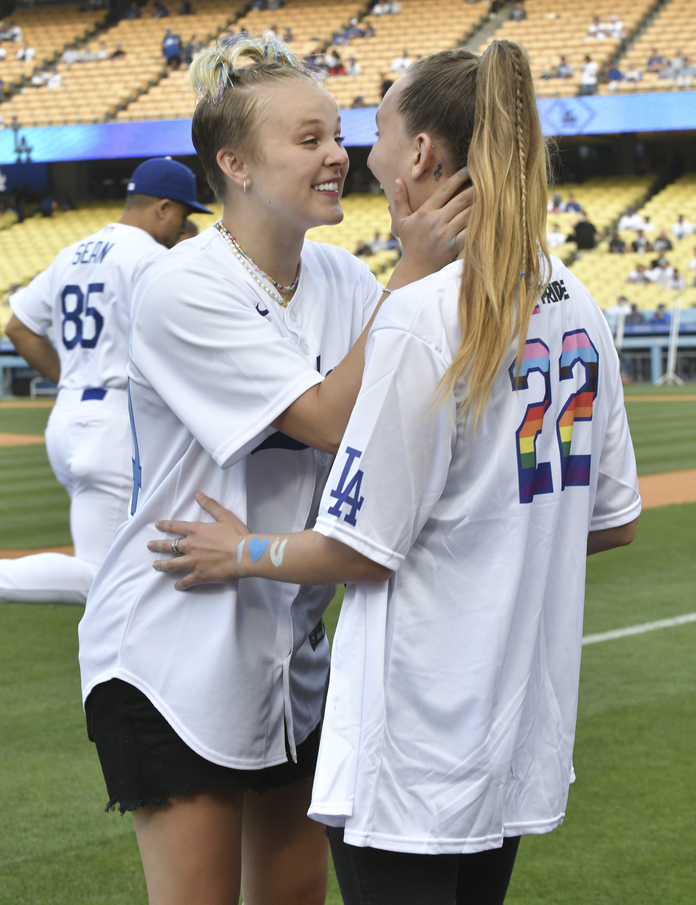 JoJo and Kylie smiling and looking into each other's eyes