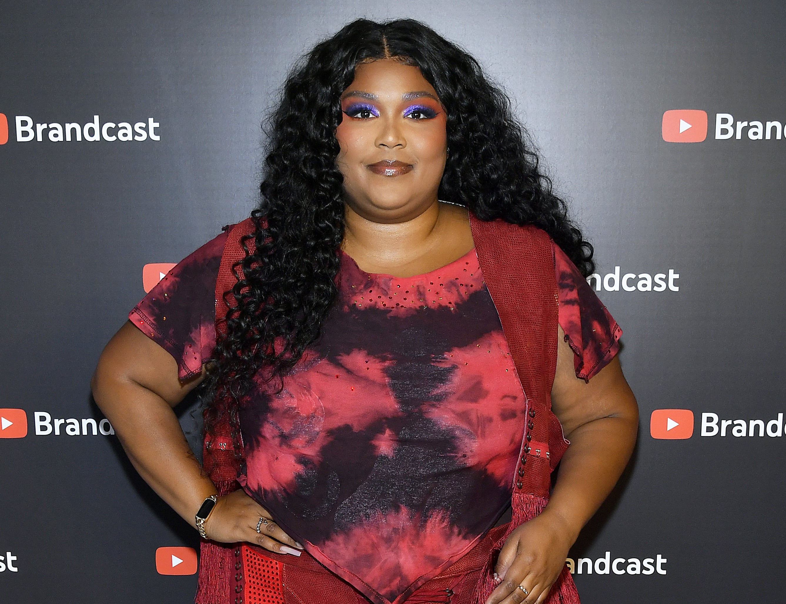 Lizzo with hand on hip on the red carpet