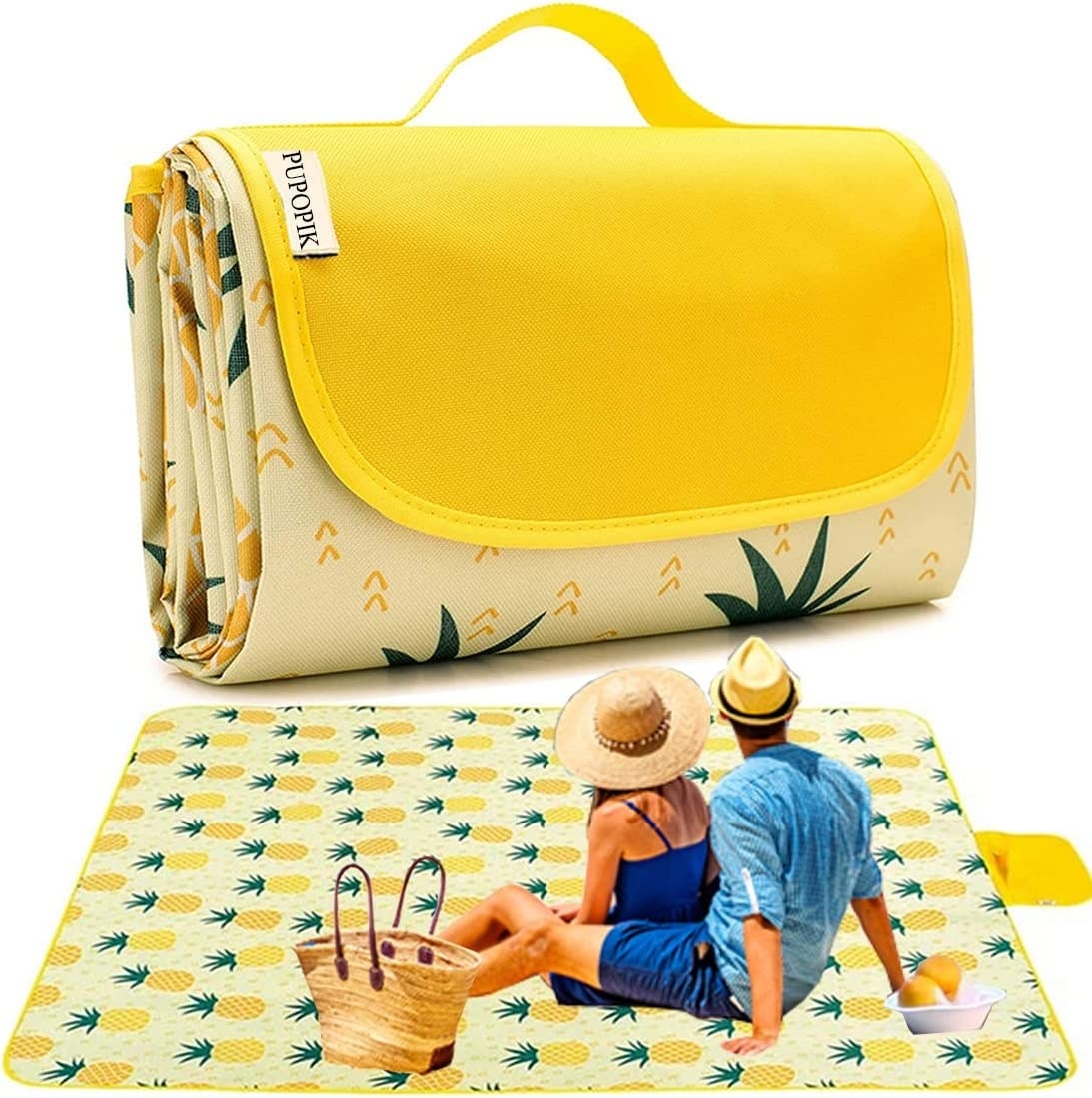 A couple sits on a large outdoor mat with pineapple print
