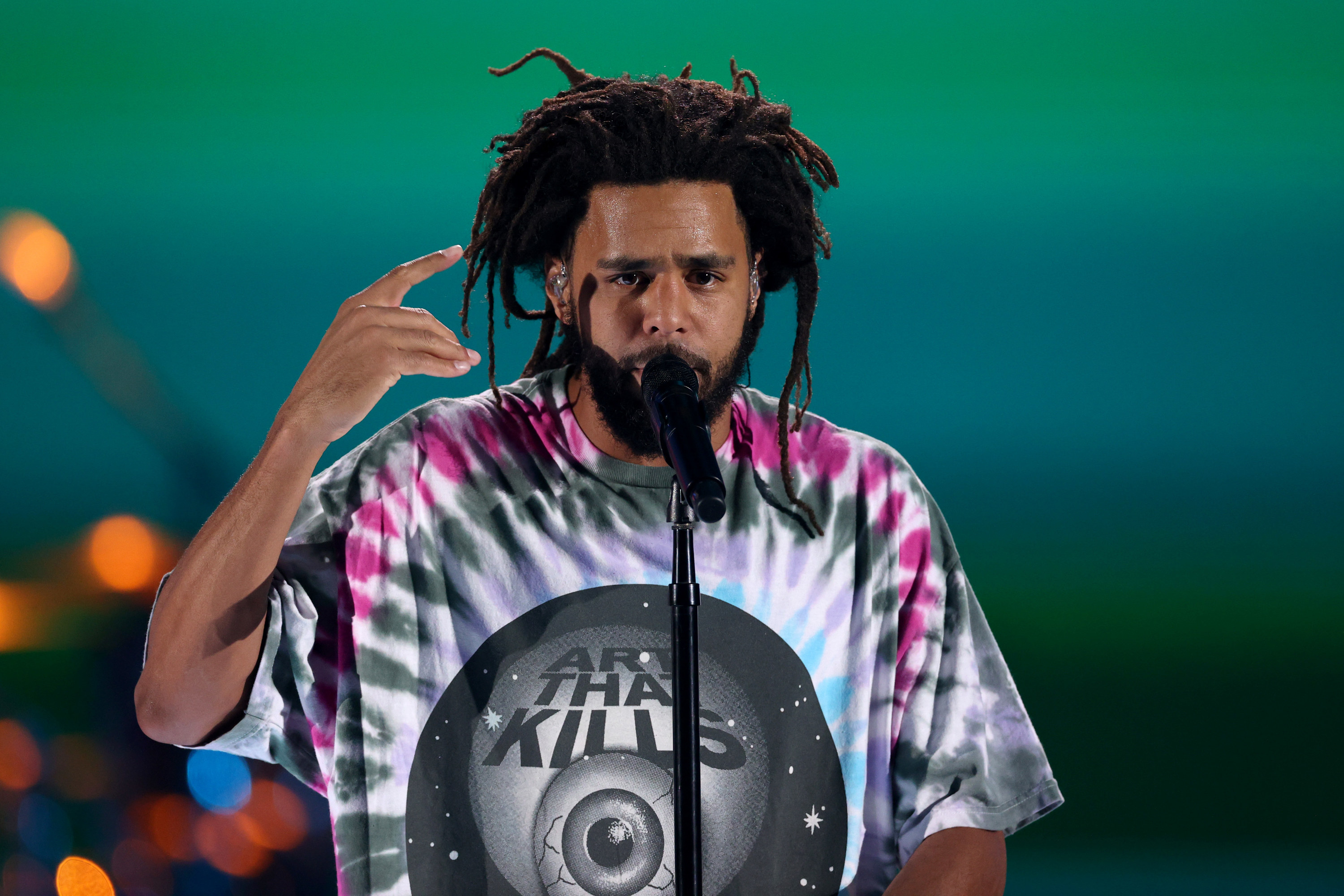J. Cole performing live.