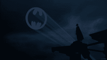 Batman looking at the Bat signal