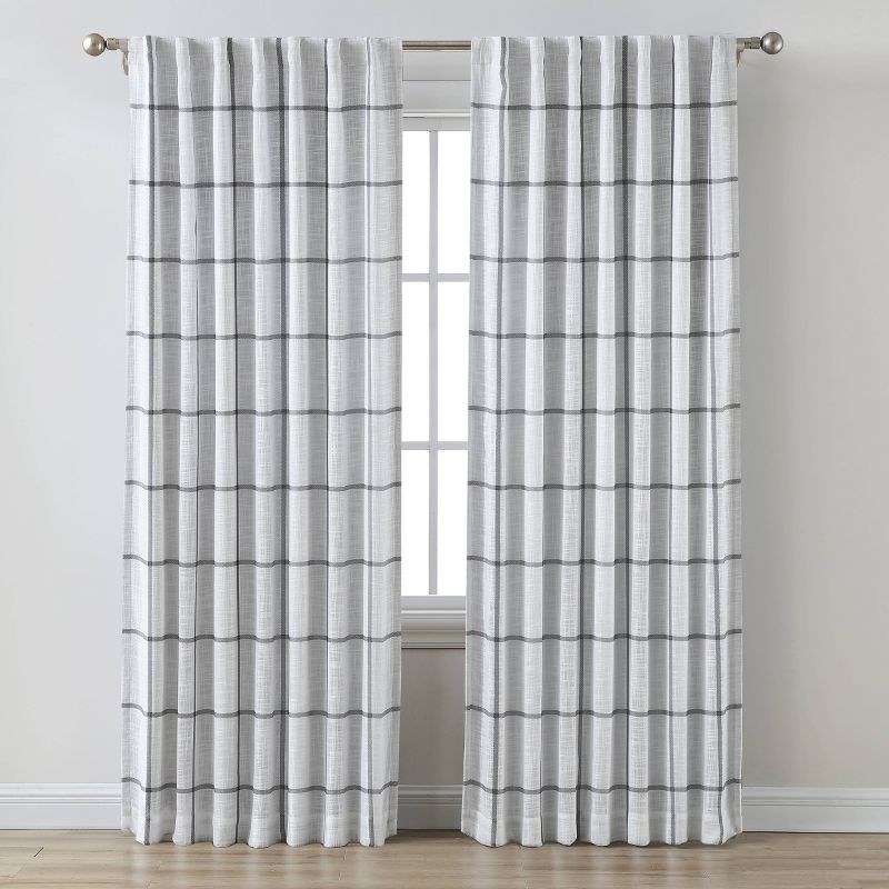 An image of two grey blackout window curtain panels