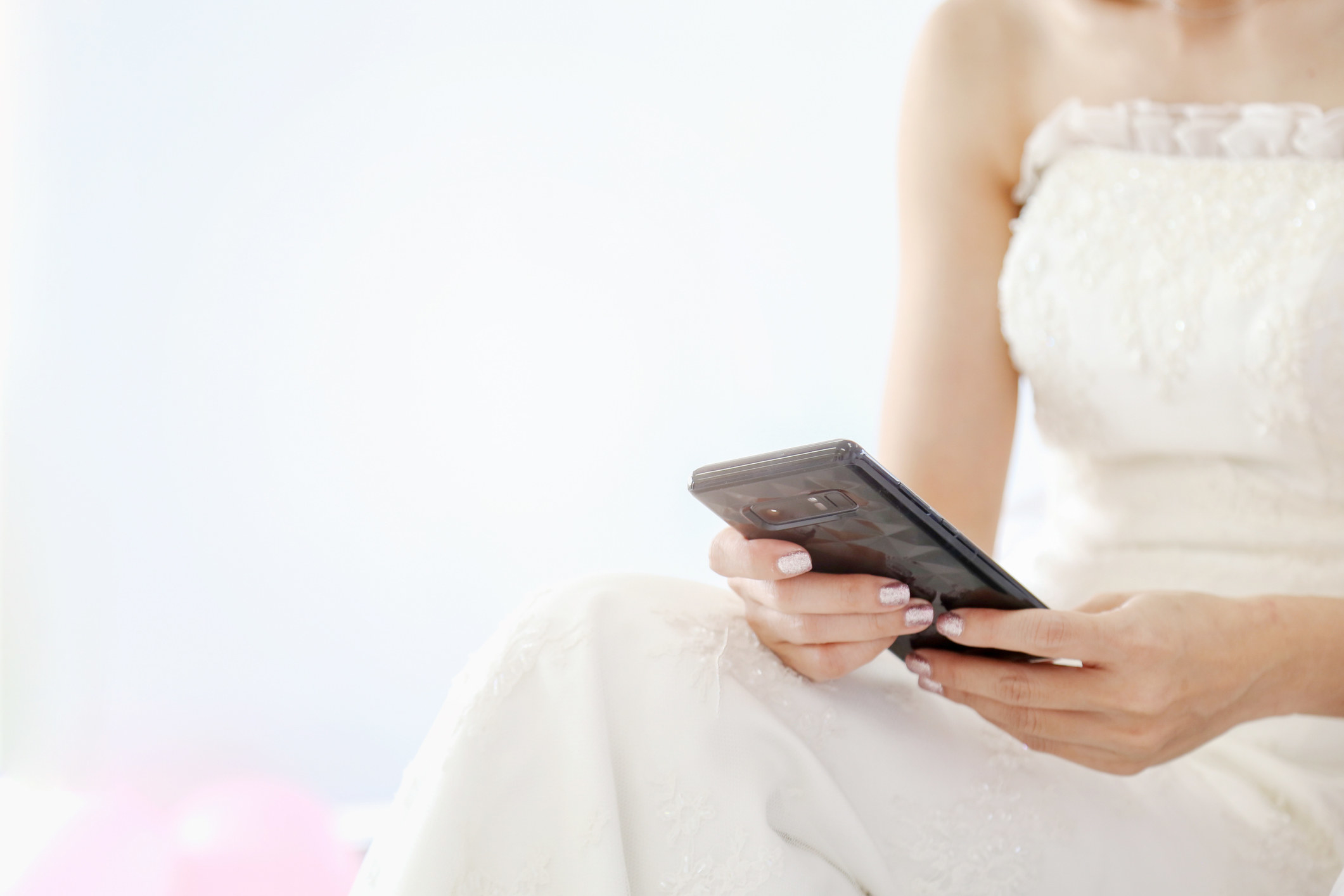 close up of a bride on her phone