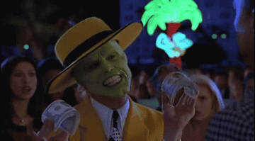 Jim Carrey from &quot;The Mask&quot; flips dollar bills at a man&#x27;s face