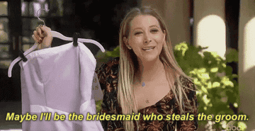 A GIF of a woman saying &quot;Maybe I&#x27;ll be the bridesmaid who steals the groom&quot;