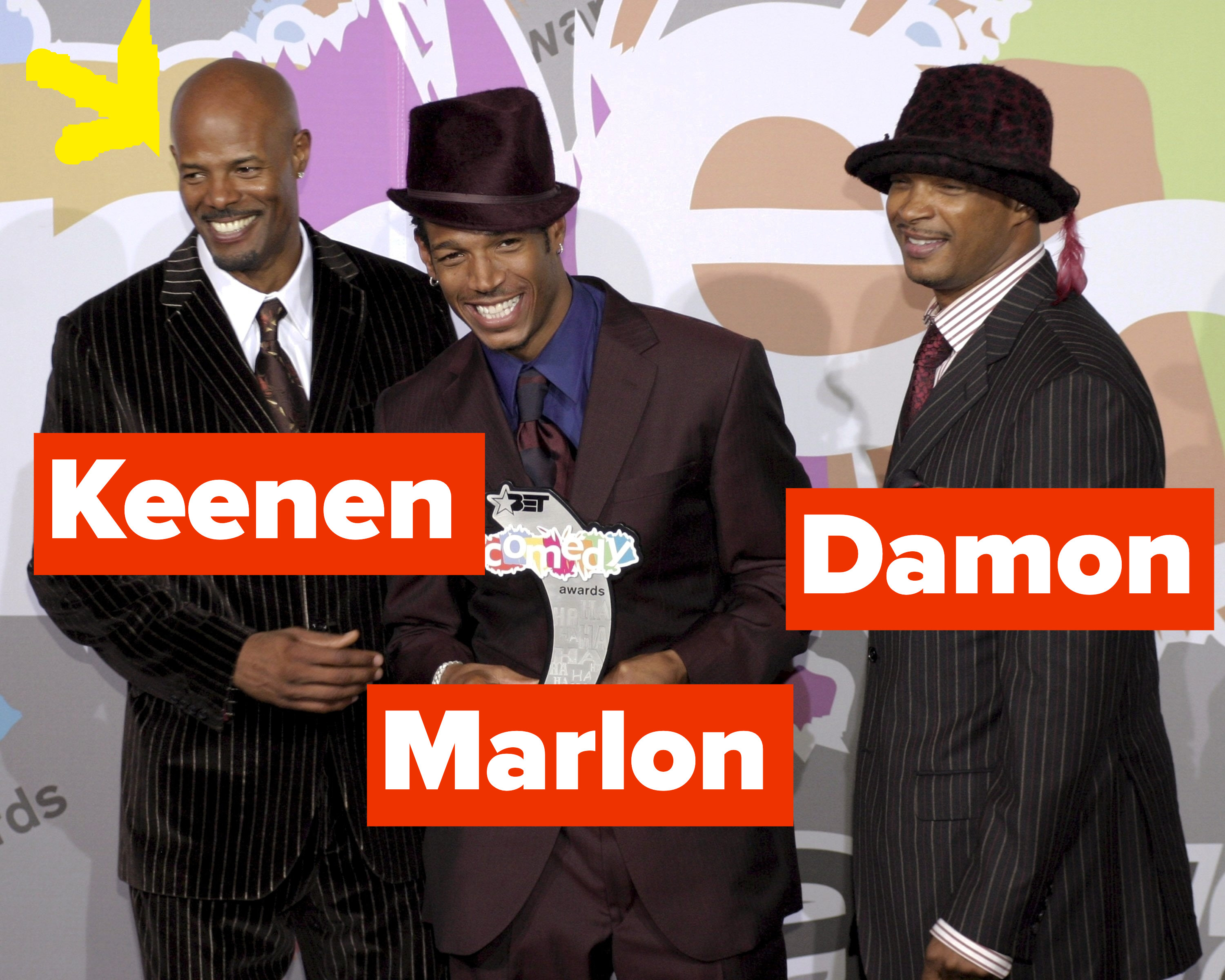 Keenen, Marlon, and Damon Wayans post for a picture wearing suits