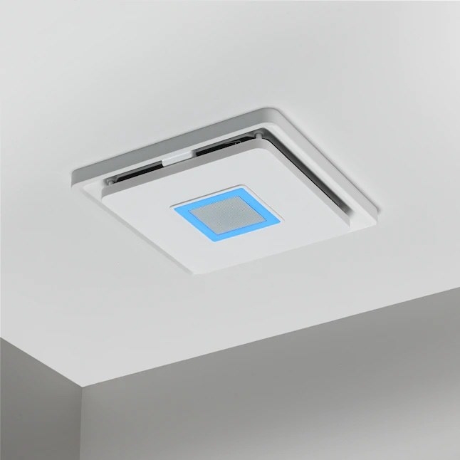 a white compatibility fan shining a blue light above a bathroom ceiling