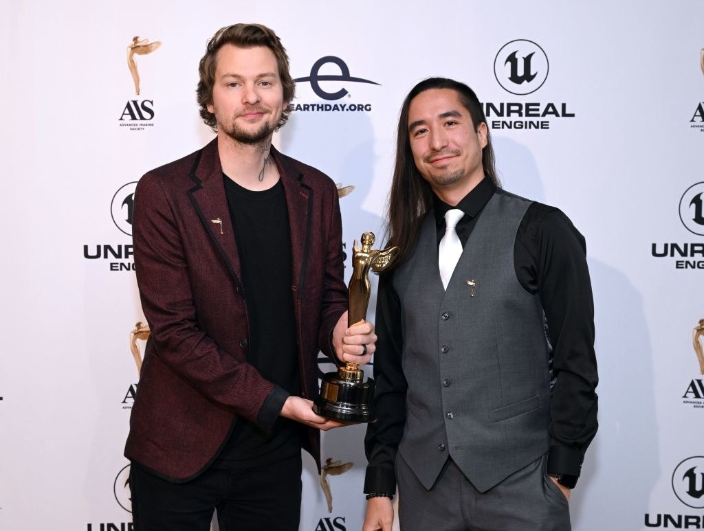 (L-R) Christian Linke and Alex Yee pose with the Best Episodic Animation award for Arcane