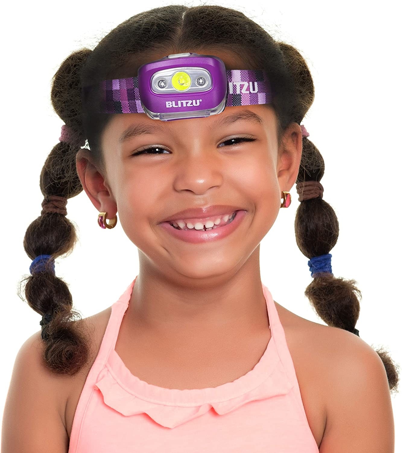 A child wearing a headlamp