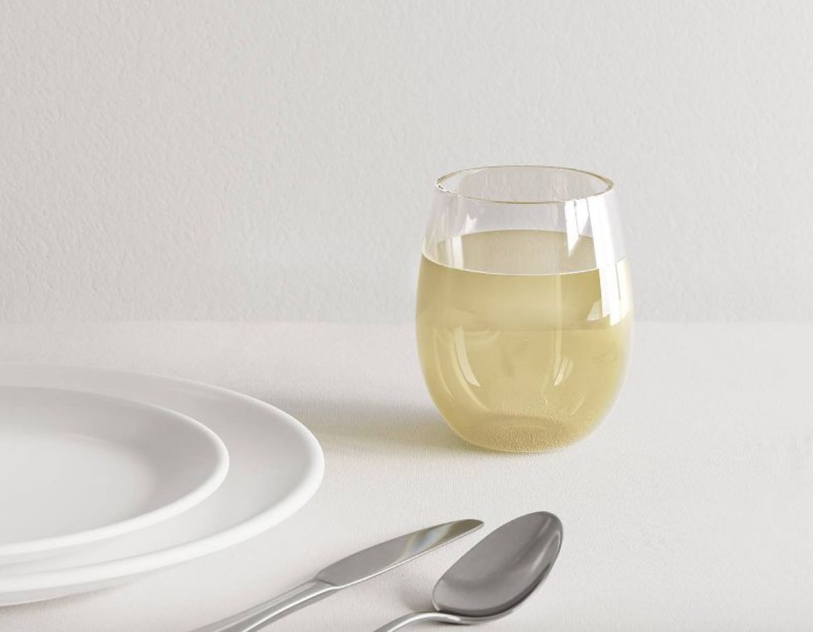 the glass filled with a white wine