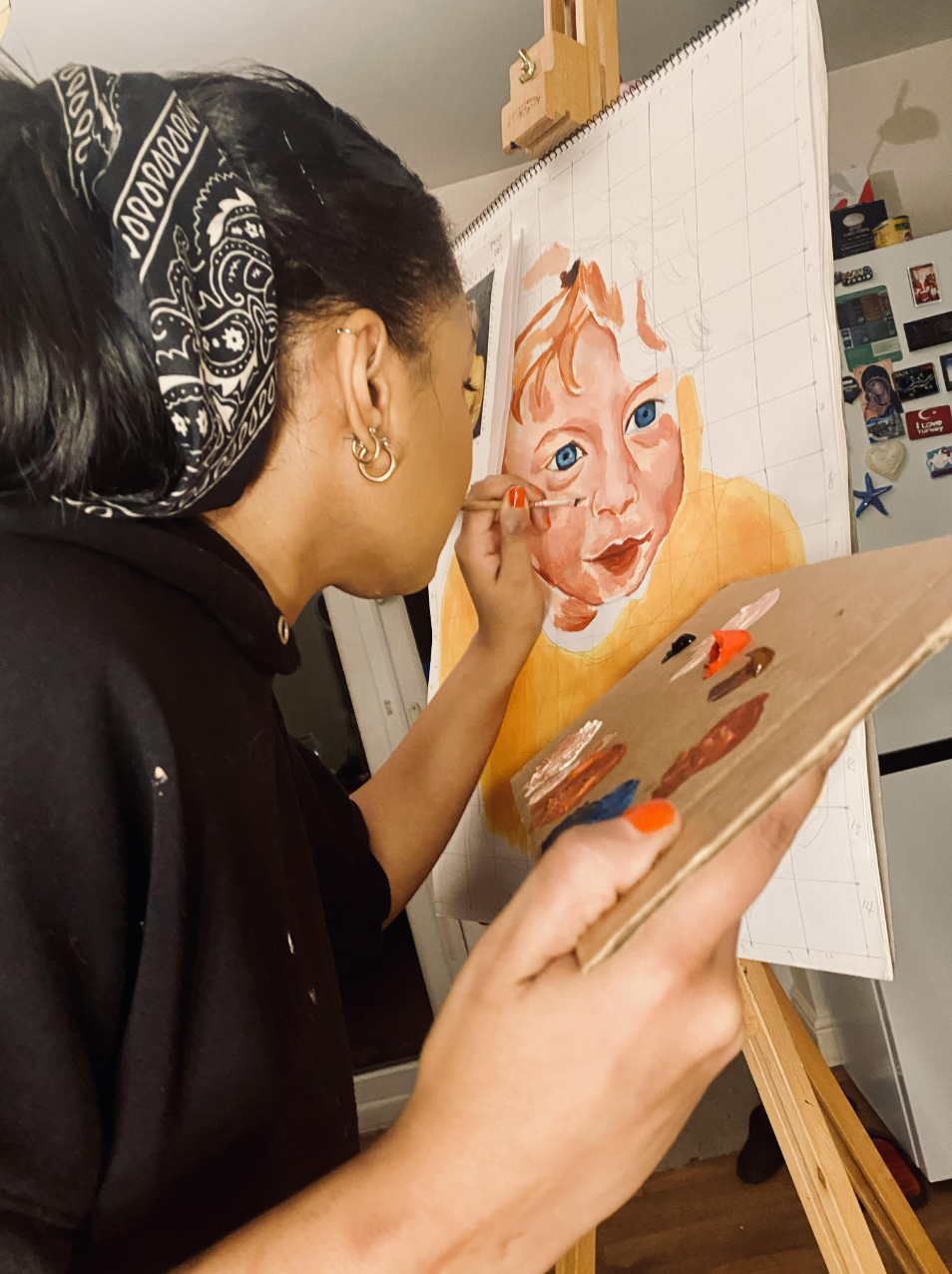 PIC woman painting portrait of child